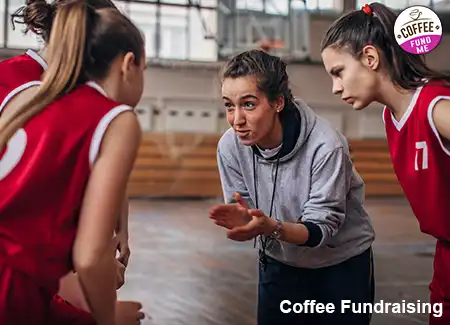 A coach is talking to a basketball team about future fundraising ideas for extra money for traveling tournaments.
