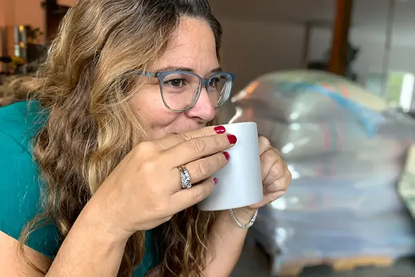 A professional coffee roaster enjoying fresh roasted coffee.